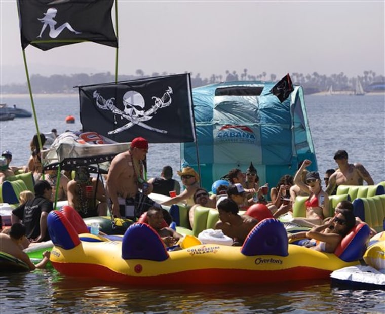 Revelers show up for the floating party off Fanuel Street Park in Pacific Beach dubbed \"Floatopia.\" on March 20, 2010 in San Diego.  San Diego's City Council may let the air out of so-called \"floatopia\" parties where people booze it up on inner tubes offshore. The council meets Monday afternoon to consider closing a loophole in the city's ban on the beach use of alcohol.  (AP Photo/San Diego Union-Tribune, Nelvin C. Cepeda)    ** SAN DIEGO COUNTY OUT, NO SALES, COMMERCIAL INTERNET OUT, FOREIGN OUT,  MANDATORY CREDIT, TV OUT **